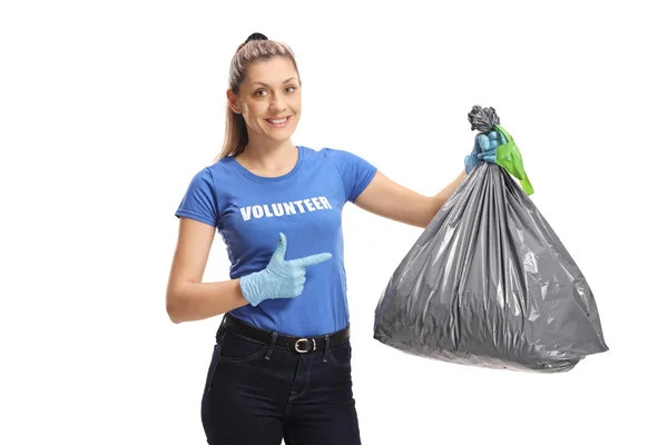 Mulher Voluntária Com Saco Lixo Apontando Para Ele Isolado Fundo — Fotografia de Stock