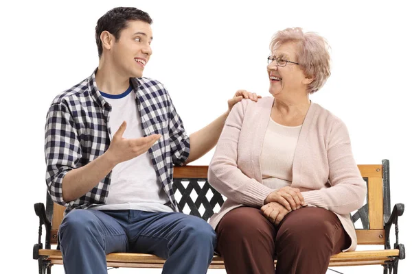 Young Guy Senior Woman Sitting Bench Talking Isolated White Background — Stock Photo, Image