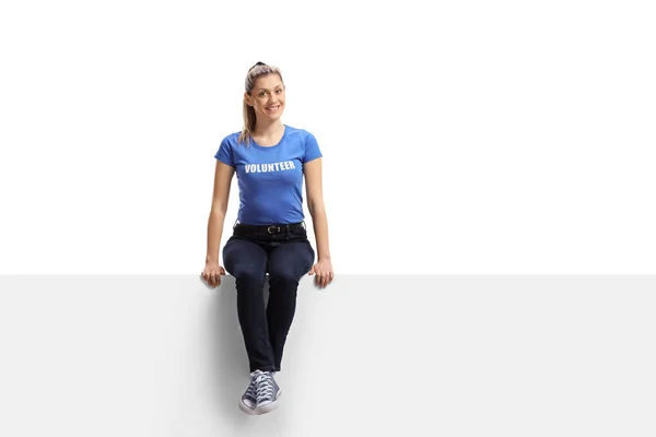 Full Length Portrait Female Volunteer Smiling Sitting White Panel Isolated — Stock Photo, Image