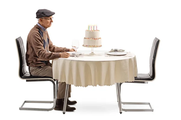 Lonely Senior Man Sitting Table Birthday Cake Isolated White Background — Stok fotoğraf