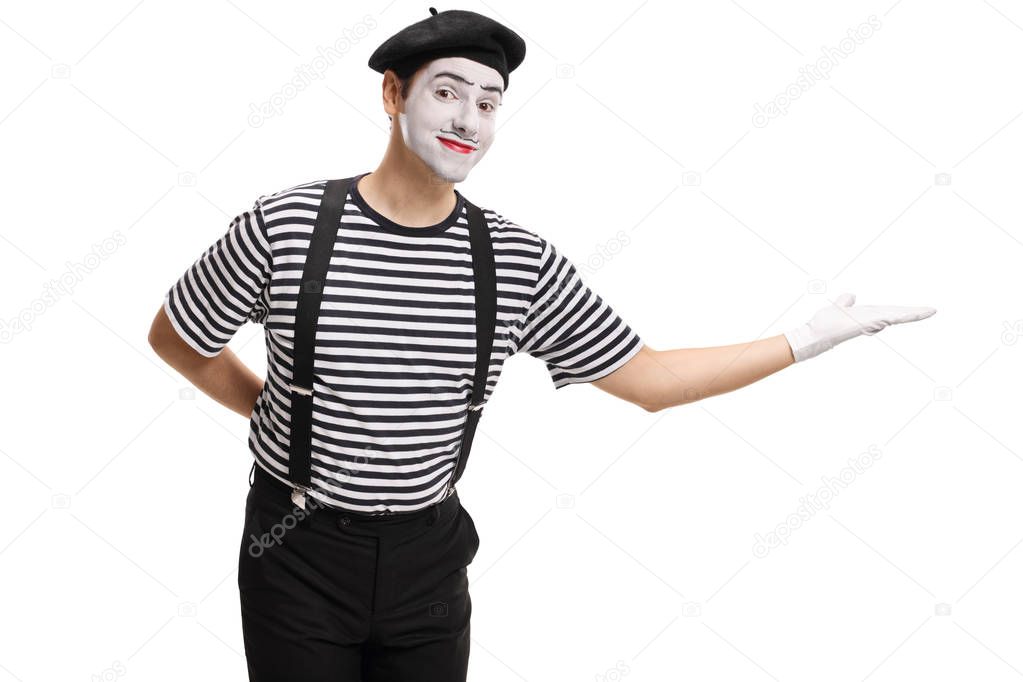 Mime gesturing welcome with his hand isolated on white background