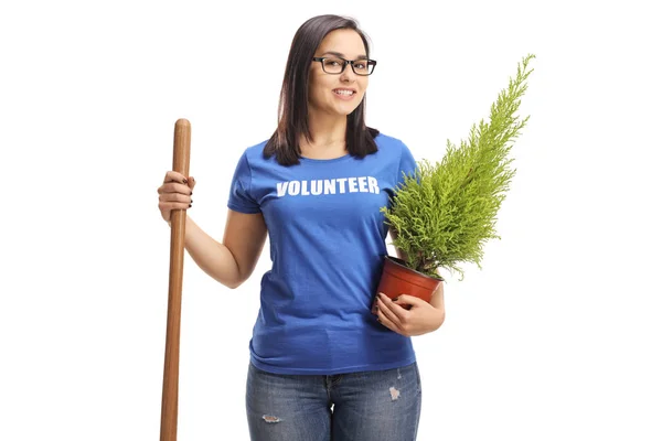 Mujer Joven Sonriente Voluntaria Con Una Planta Una Pala Aisladas —  Fotos de Stock