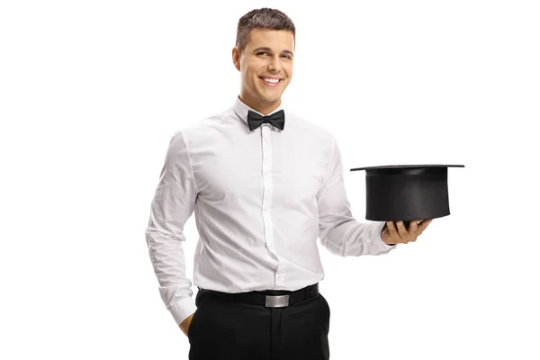 Alegre Mago Sosteniendo Sombrero Vacío Sonriendo Cámara Aislada Sobre Fondo —  Fotos de Stock