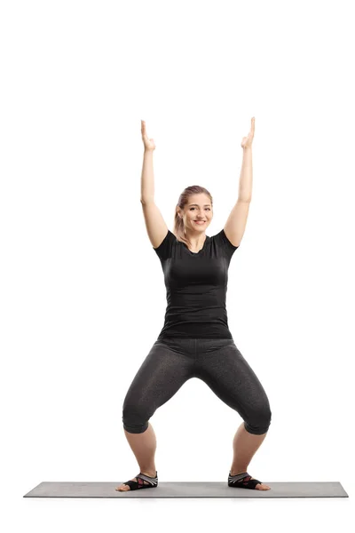 Full Length Portrait Young Woman Stretching Arms Exercising Mat Isolated — Stock Photo, Image