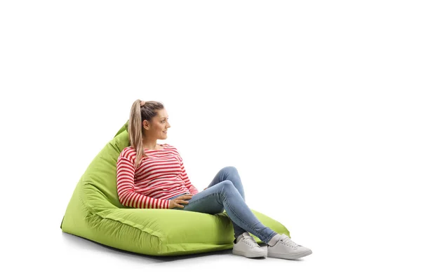 Young casual woman sitting on a bean bag — 스톡 사진