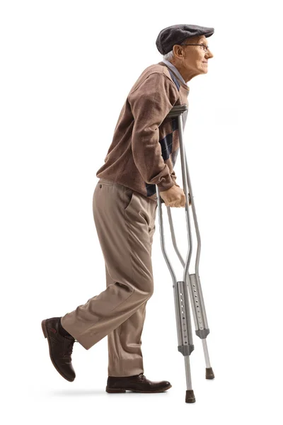 Full Length Profile Shot Senior Man Walking Crutches Isolated White — Stock Photo, Image