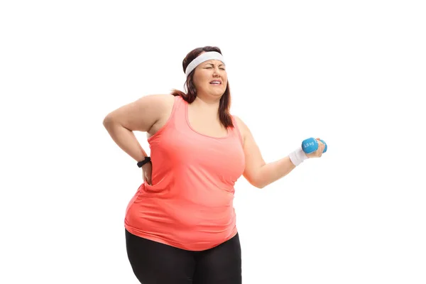 Overgewicht vrouw strop om een kleine halter heffen — Stockfoto