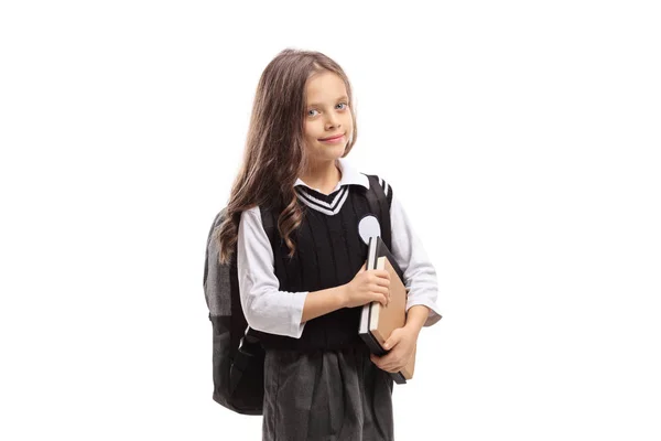 Écolière en uniforme avec livres — Photo