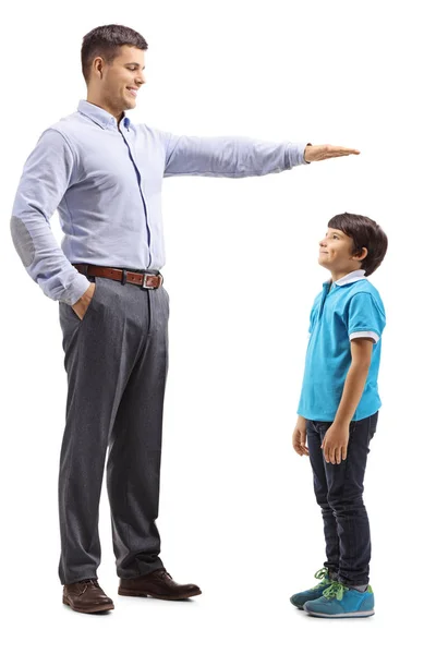 Full Length Shot Father Measuring How Tall His Son Isolated — Stock Photo, Image