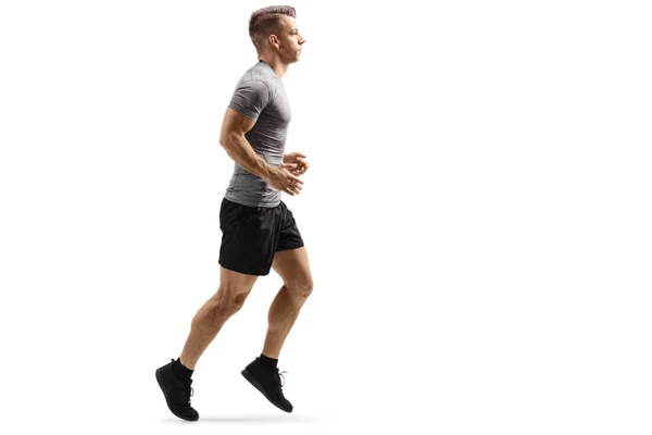 Jonge gespierde man joggen — Stockfoto