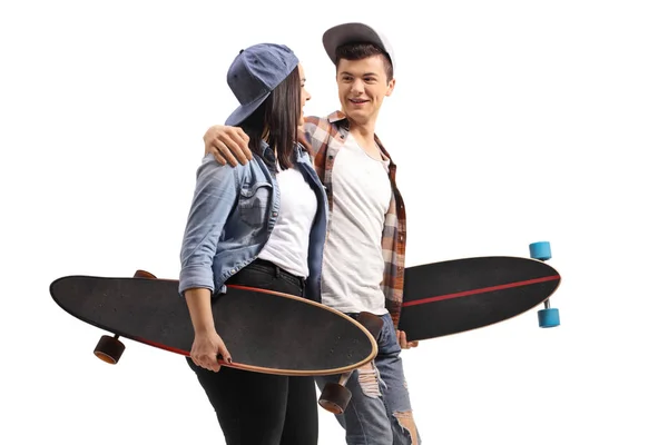 Young male and female skaters with longboards talking to each ot — Stock Photo, Image