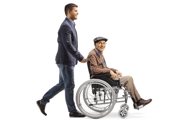 Full Length Shot Young Man Pushing Elderly Man Wheelchair Isolated — Stock Photo, Image