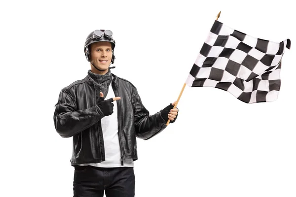 Young Male Biker Waving Checkered Race Flag Pointing Isolated White — Stock Photo, Image