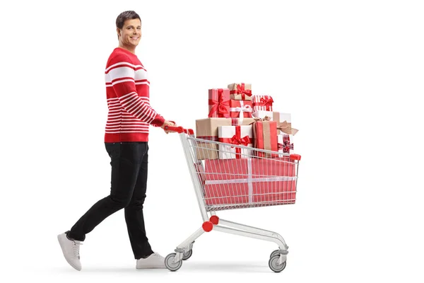 Foto Perfil Completo Joven Con Carrito Compras Lleno Regalos Caminando —  Fotos de Stock