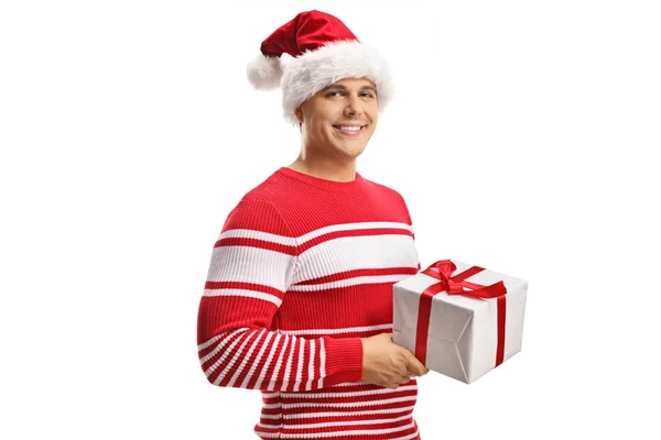 Young Man Wearing Santa Claus Hat Holding Christmas Gift Box — Stock Photo, Image