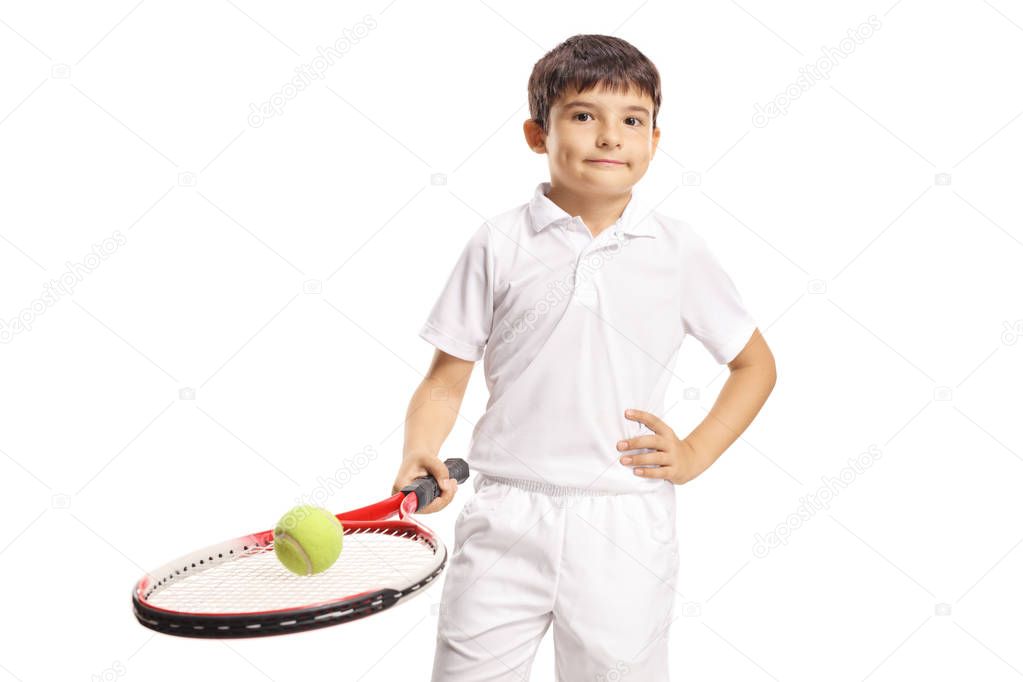 Boy holding a tennis ball on a racquet