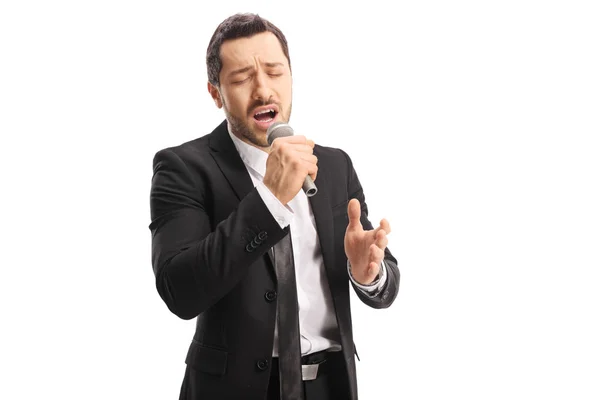 Emotionele Jonge Mannelijke Zanger Zingen Een Microfoon Met Gesloten Ogen — Stockfoto