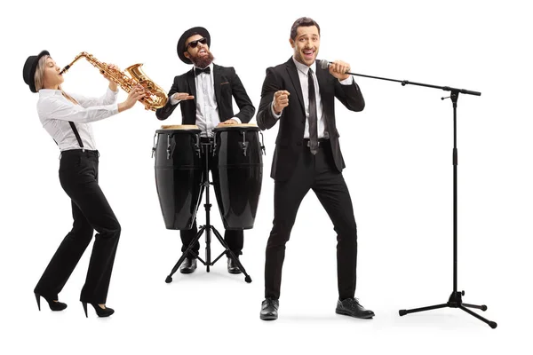 Band playing on a sax and conga drums and a singer singing on a — Stock Photo, Image