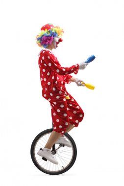 Juggler palyaço sürme bir Unicycle ve hokkabazlık