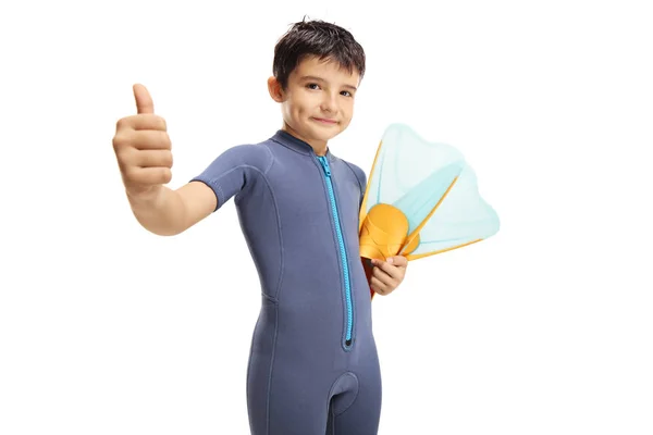 Boy in a wetsuit holding a diving mask and showing thumbs up — Stock Photo, Image