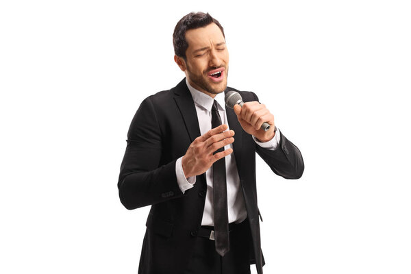 Man singing on a microphone with emotional face expression 
