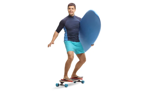 Full Length Portrait Young Man Carrying Surfboard Riding Skateboard Isolated — Stock Photo, Image