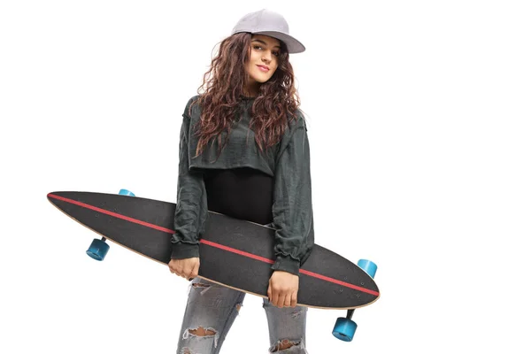 Portrait of a young trendy female holding a longboard — Stock Photo, Image