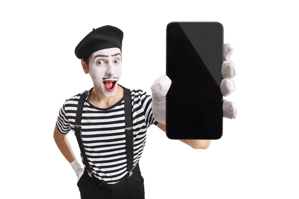 Podekscytowany MIME pokazując telefon komórkowy — Zdjęcie stockowe