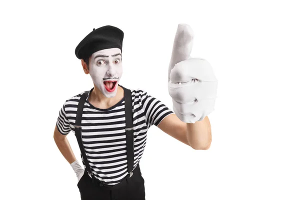Веселый молодой человек-пантомима показывает большие пальцы вверх — стоковое фото