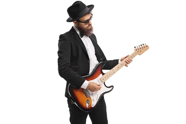 Músico masculino tocando uma guitarra baixo — Fotografia de Stock