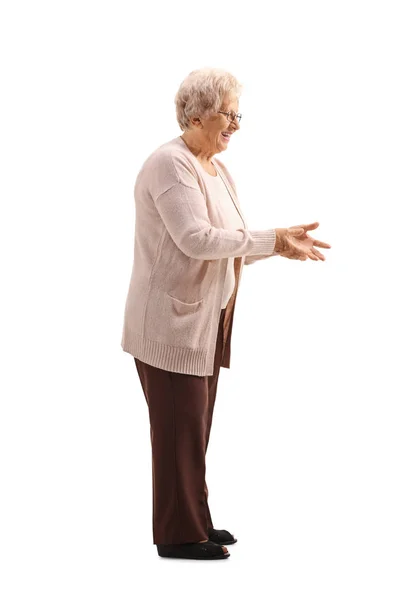 Elderly woman waiting to receive something — Stock Photo, Image