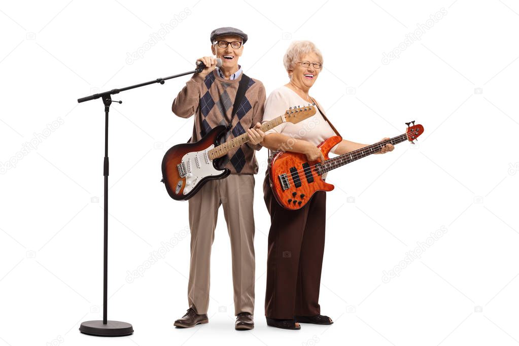 Senior musicians with electric guitar and a microphone