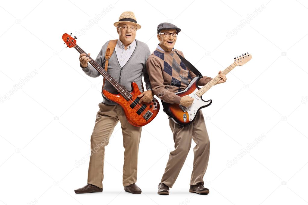 Two cheerful senior men playing electric guitars