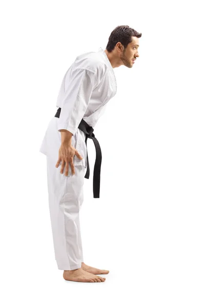 Hombre en kimono de karate con cinturón negro esquivando su cabeza — Foto de Stock
