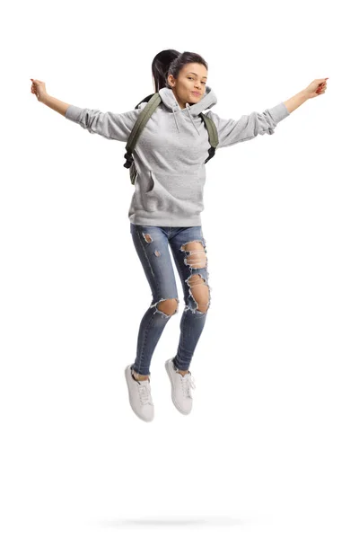 Női hallgató hátizsák jumping — Stock Fotó