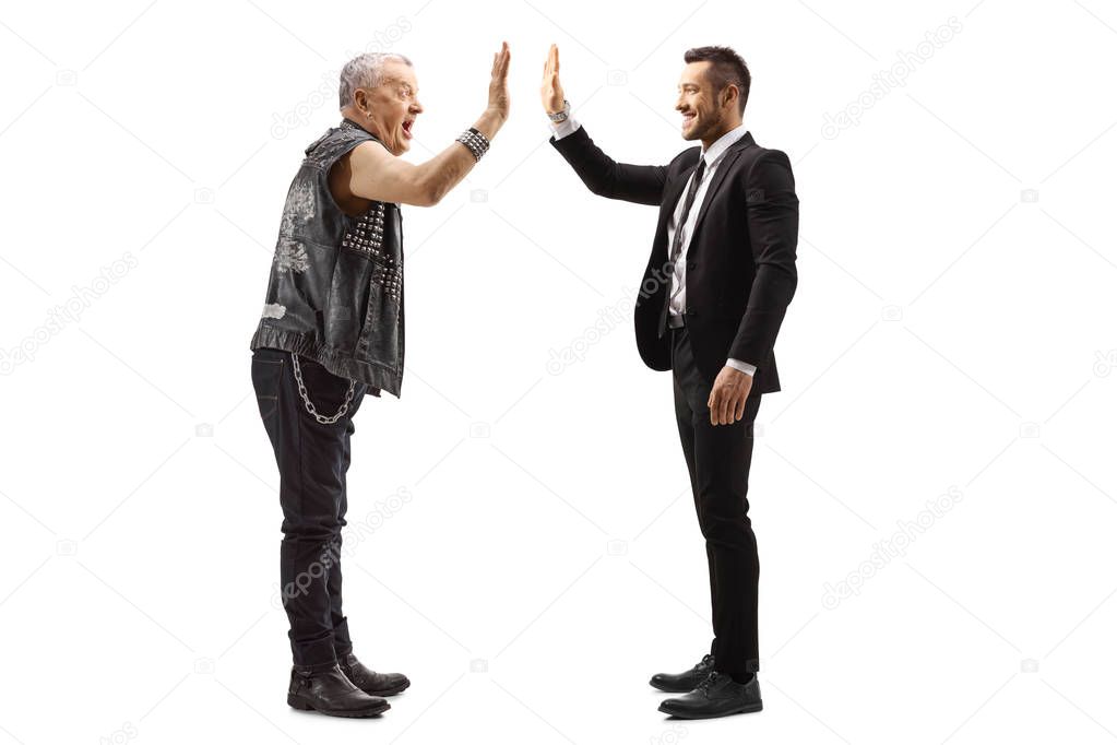 Businessman gesturing high-five with a mature rocker 