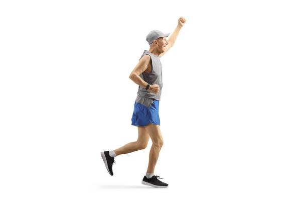 Elderly man in sportswear running and gesturing happiness — Stock Photo, Image
