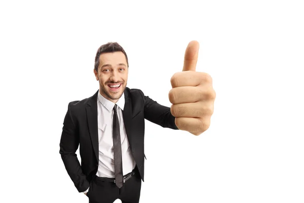 Jonge zakenman het maken van een duim omhoog teken en glimlachend — Stockfoto