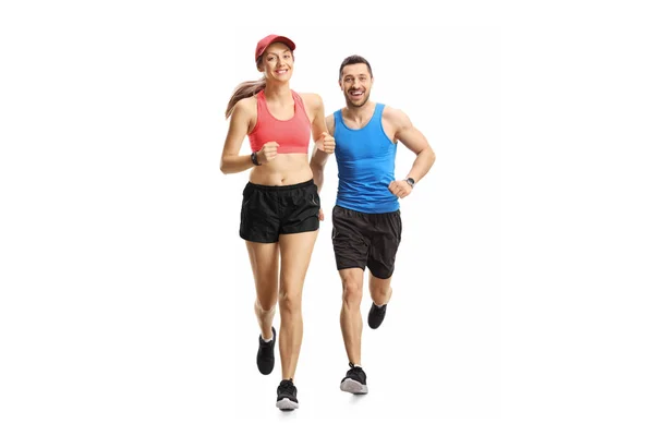 Joven hombre y mujer corriendo — Foto de Stock