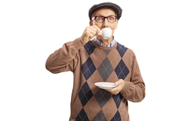 Starší muž usrkávat kávu espreso — Stock fotografie