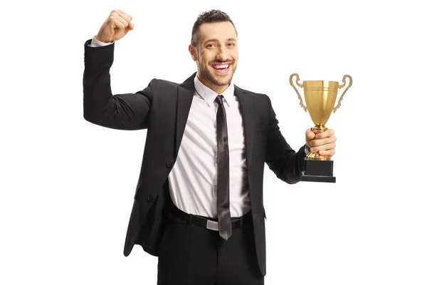 Happy man in a suit holding a gold trophy cup — Stock Photo, Image