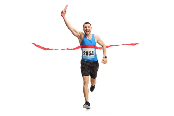 Hombre terminando una carrera de relevos con un bastón en la mano — Foto de Stock