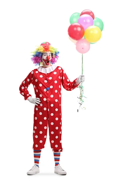 Fröhlicher Clown mit einem Bündel Luftballons — Stockfoto