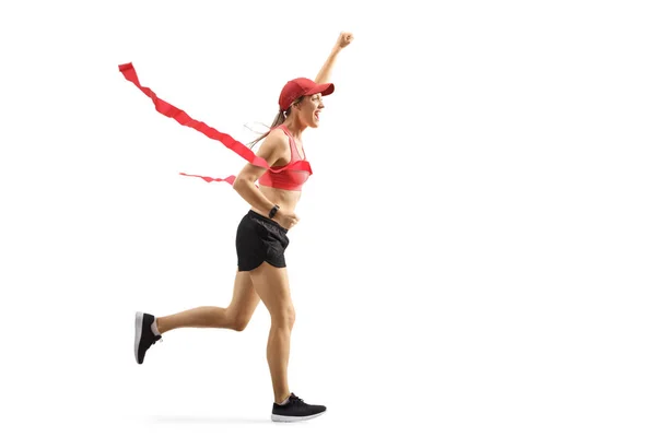 Junge glückliche Frau läuft auf der Ziellinie eines Rennens und gestu — Stockfoto