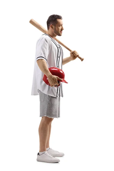 आदमी एक बेसबॉल बल्लेबाज और एक लाल हेलमेट पकड़े हुए — स्टॉक फ़ोटो, इमेज