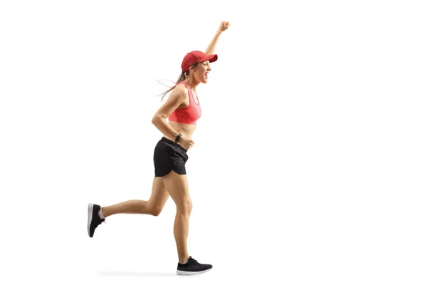 Mutlu genç kadın koşucu evet gesturing — Stok fotoğraf
