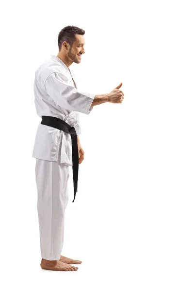 Hombre en kimono de karate dando un pulgar hacia arriba —  Fotos de Stock