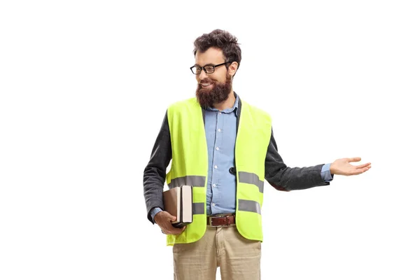 Male teacher wearing safety vest, gesturing welcome with hand an — Stock Photo, Image