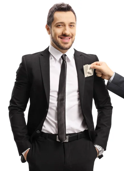 Jonge zakenman krijgt omkopen en glimlachend — Stockfoto