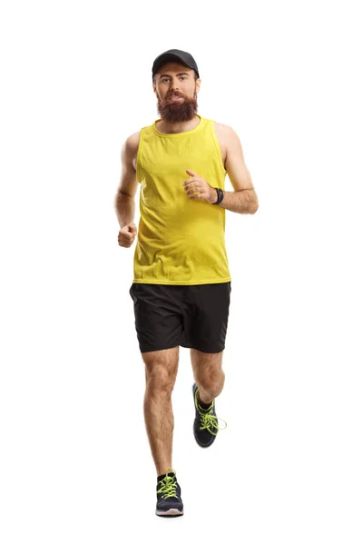 Brodaty facet jogging w kierunku kamery — Zdjęcie stockowe